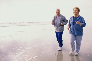 Elderly man and woman on the beach